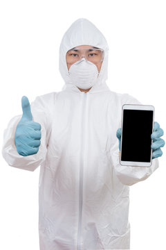 Asian scientist in protective wear holding smartphone with thumbs up