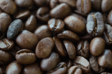 blured roasted coffee beans  for background with copy space