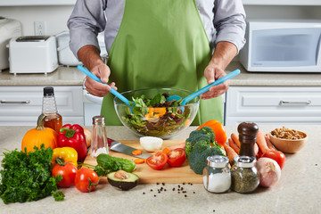 Chef man cooking in the kitchen.