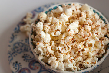 Colorful Bowl of Popcorn sprinkled with Cinnamon 
