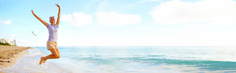 Woman jumping on the beach