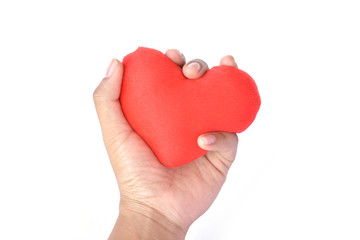 Hand holding red heart shape on white background