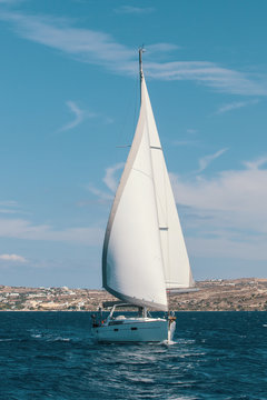 Ship yachts with white sails in the Sea. Sailing. Luxury boats.