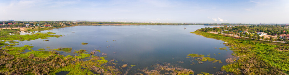 Aerial view of tranquil lake near Pattaya city in morning, panorama view