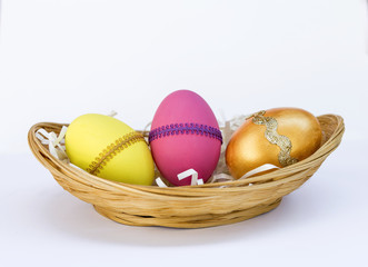 Colorful design Easter egg in bamboo basket