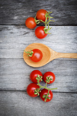 Cherry tomato over wooden vintage background