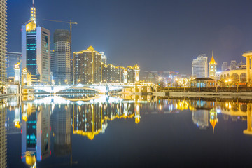 Naklejka premium River And Modern Buildings Against Sky in Tianjin,China.