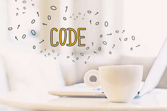Code concept with a cup of coffee