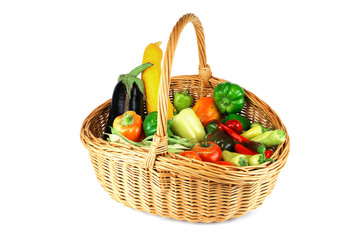 new picked fresh vegetables in basket isolated on white background