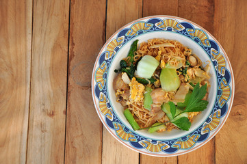 Instant noodles fried with egg Pork and vegetables. copy space.