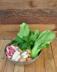 pork, vegetables, mushrooms, eggs, celery, arranged in a metal bowl. Copy space. Object.
