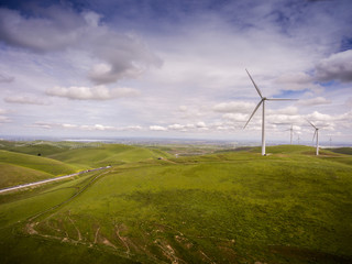 Fototapeta na wymiar Windmill - Wind Turbine on Hill
