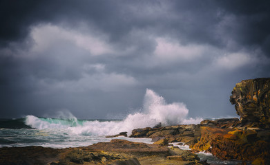 Winter Storm Waves breaking shoreline. Copyspace.