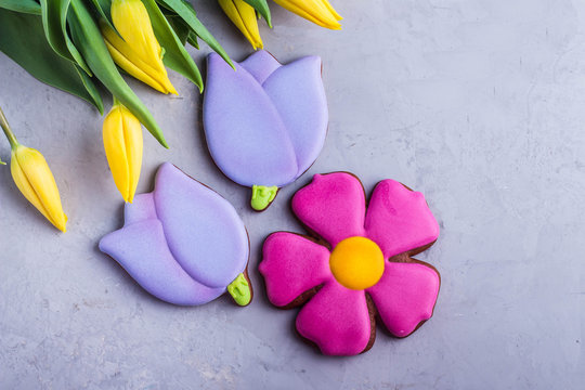 Spring background card cookies and flowers yellow tulips. Easter or Mother day holidays content