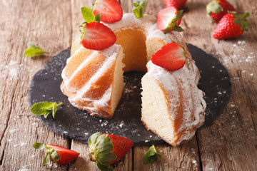 Pound Cake cake with mint and strawberry close-up. Horizontal