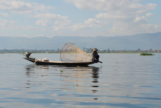 Resting in his boat the fisherman on the Inle lake, Myanmar