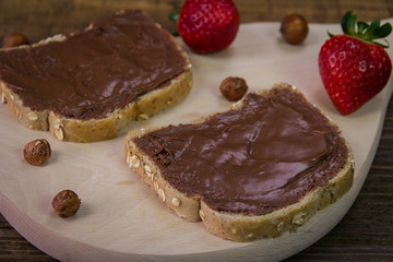 Bread with chocolate cream and strawberry