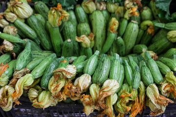 Fresh zucchini in a box in a grocery store for sale in the greek market.