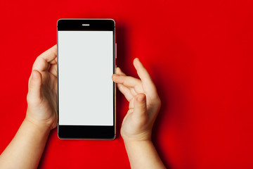 smart phone in the hands of a child