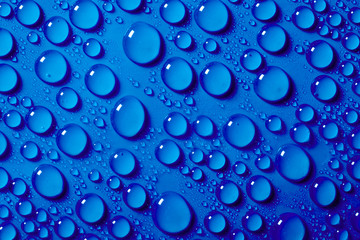 Water drops on the blue background