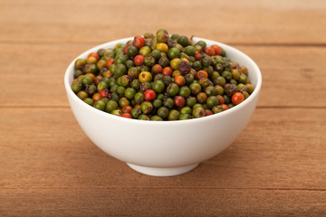 fresh green and orange peppercorns