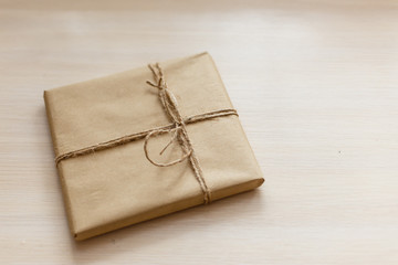 Vintage Brown gift box on wooden background - filter processing