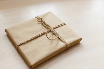 Vintage Brown gift box on wooden background - filter processing