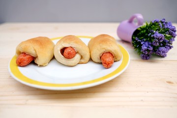 Sausage Bread in Dish on Table Wood 