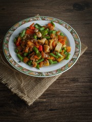 Vintage style Thai traditional and Chinese food stir fried vegetable in brown sauce with dried shrimp