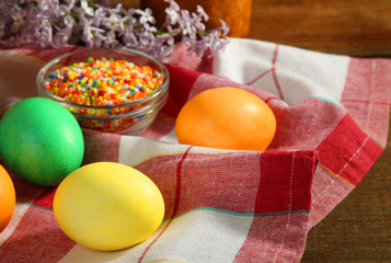 Dyed eggs and powder for baking on a napkin