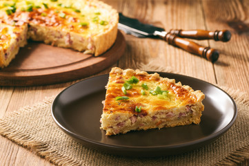 Traditional french pie with bacon and cheese - quiche lorraine.