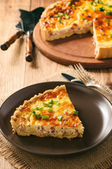Traditional french pie with bacon and cheese - quiche lorraine.