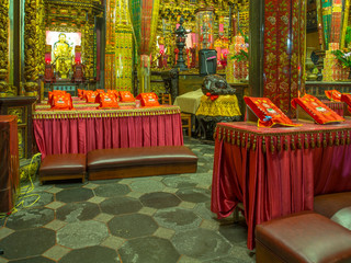 Taipei, Taiwan - October 04, 2016: Coloured altars and kneelers in a temple on Taiwan