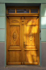 Ancient wooden door. Street facade. Riga. Latvia, Europe.