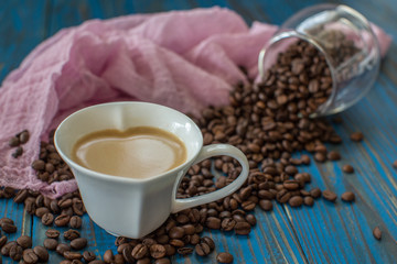 Roasted Coffee beans in heart shape cup.