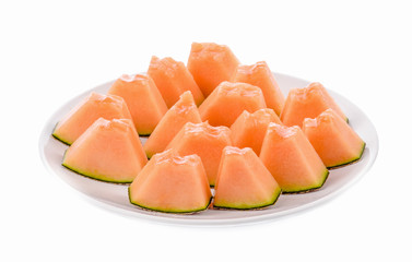 Fototapeta na wymiar Melon slices arranged on a plate.