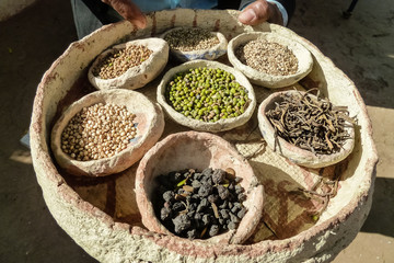 Basket with grain and dried spices on a market in Jodhpur, Rajasthan, India