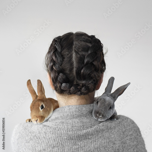 "Cute pet bunny rabbits cuddling woman" Stock photo and royaltyfree images on Pic