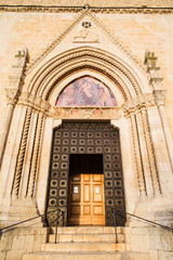 Fototapeta na wymiar SULMONA, ITALY - FEBRUARY,2017: Artistic doorway of San Filippo Neri church to Sulmona