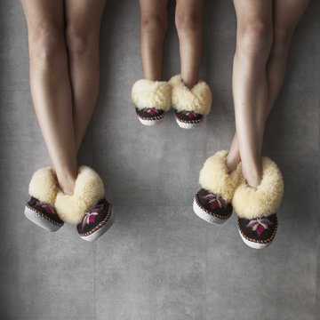 Family girls showing legs wearing matching slippers