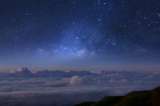 Fototapeta Milky way galaxy over foggy mountains in Thailand. Long exposure photograph.with grain