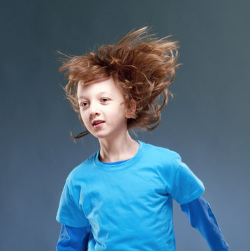 Portrait Of A Boy With His Hair Flying