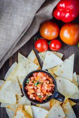 Hot mexican salsa - spicy dip with nachos - chips from corn