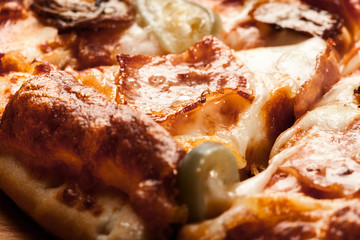 Slices of pizza with bacon, olives and jalapeno papper