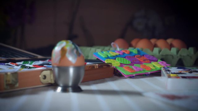 4K Home Shot Of Child Painting Easter Eggs
