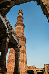 Fototapeta na wymiar View of Qutb Minar through an arch, Qutb complex, Delhi, India