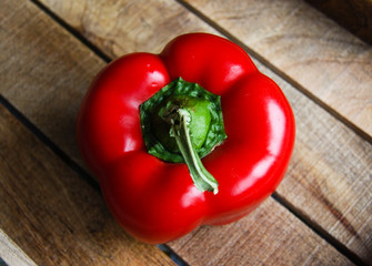 Red paprika closeup on wooden table 4