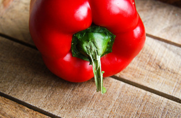 Red paprika closeup on wooden table 5
