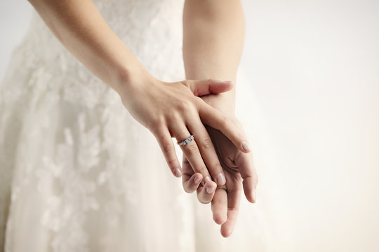 Wedding ring on bride, close up on hands