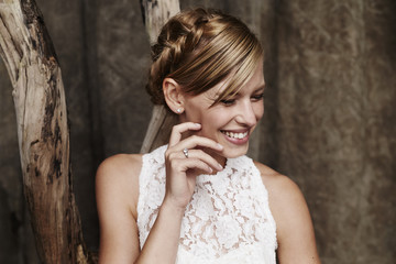 Fototapeta premium Excitable bride laughing in studio